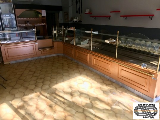 Vitrine réfrigérée d'occasion en L pour magasin boulangerie pâtisserie